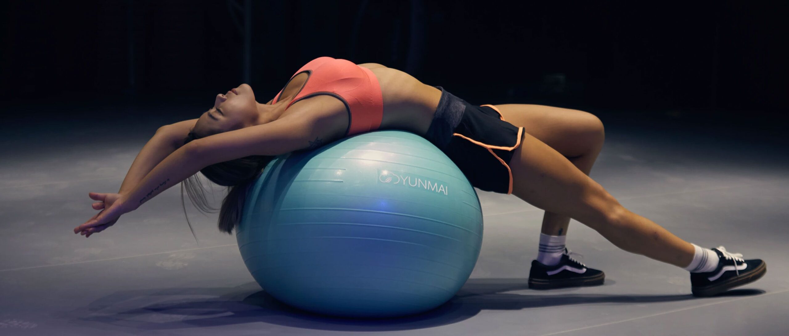 Woman Stretching Over a Gym Ball Woman Stretching Over a Gym Ball